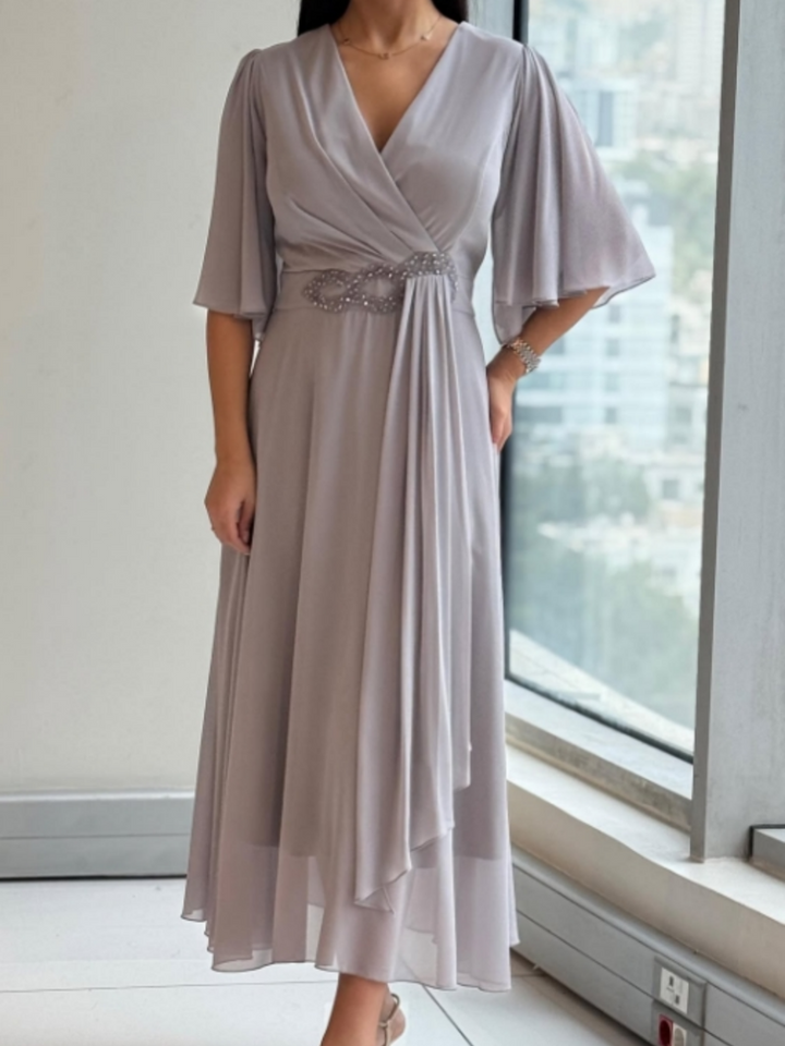 Elegant women's V-neck maxi dress with flowing design and adjustable straps, perfect for summer casual or evening wear.