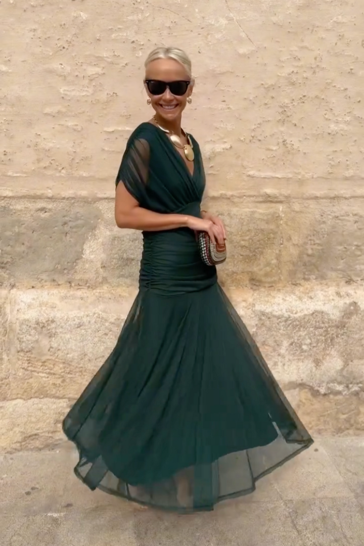 Beautiful women's evening maxi dress. V-neck & flutter sleeves offer elegant, comfortable party wear.