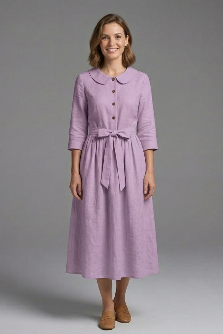 Refined women's V-neck midi dress with a waist tie. Elegant, versatile women's clothing for flattering fashion.