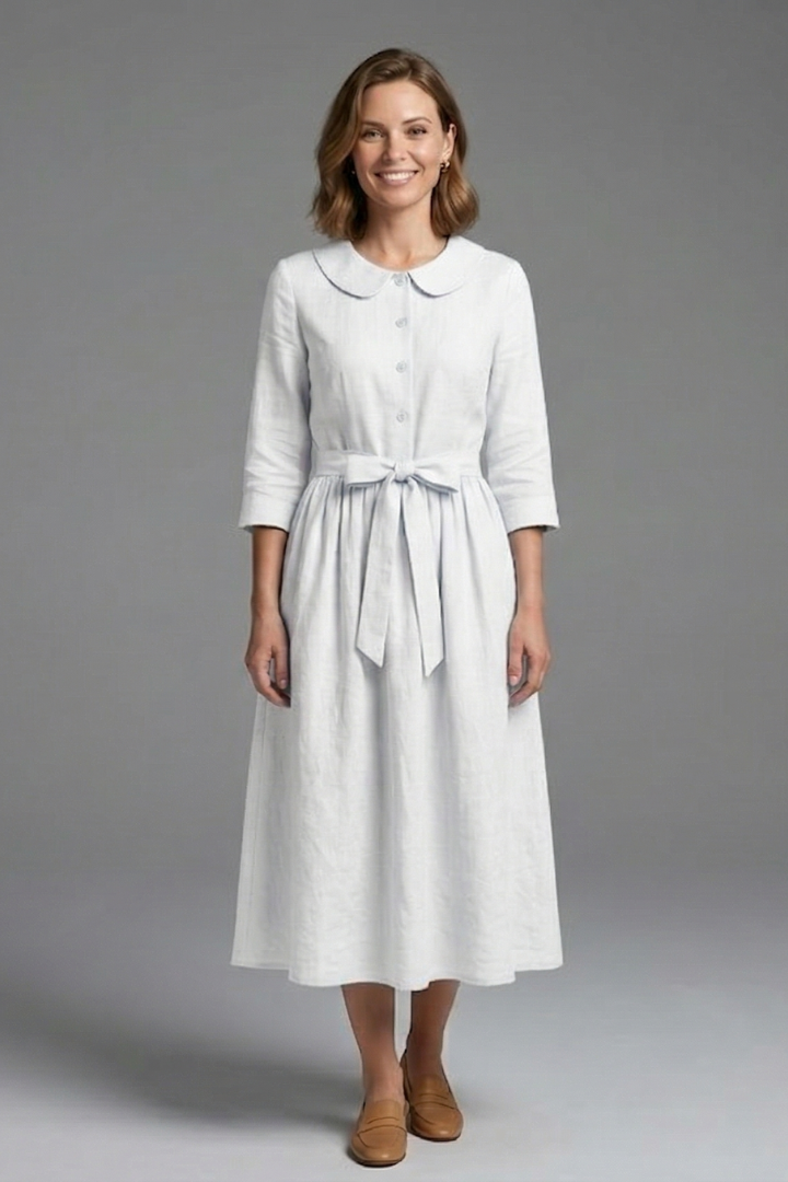 Trendy women's V-neck midi dress with a flattering waist tie. Elegant women's fashion for any occasion.