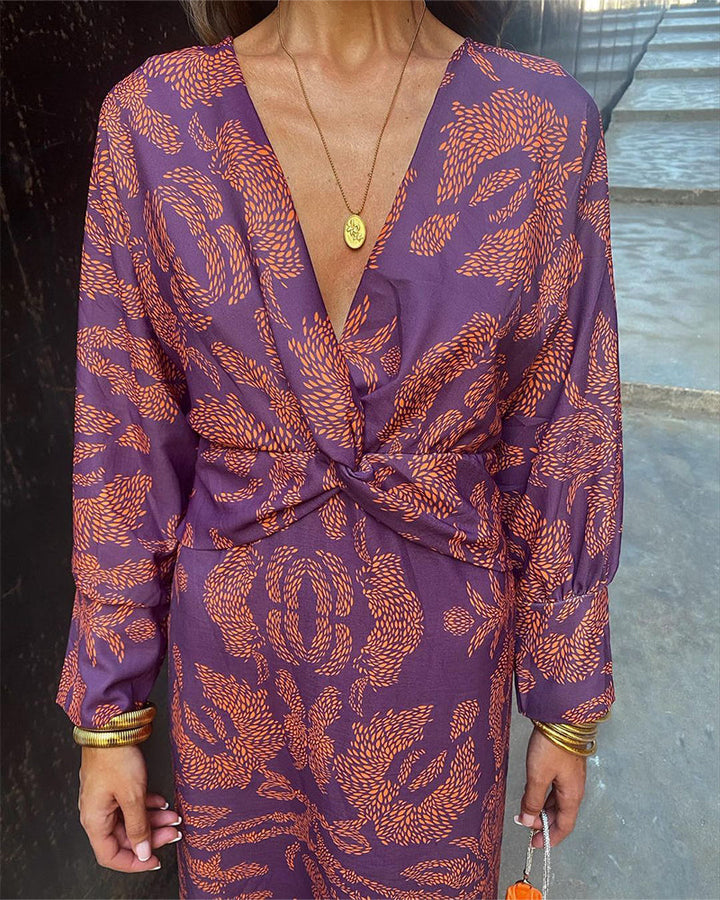 Chic women's V-neck midi dress with elegant knot detail, long sleeves, suitable for special events and dinner.
