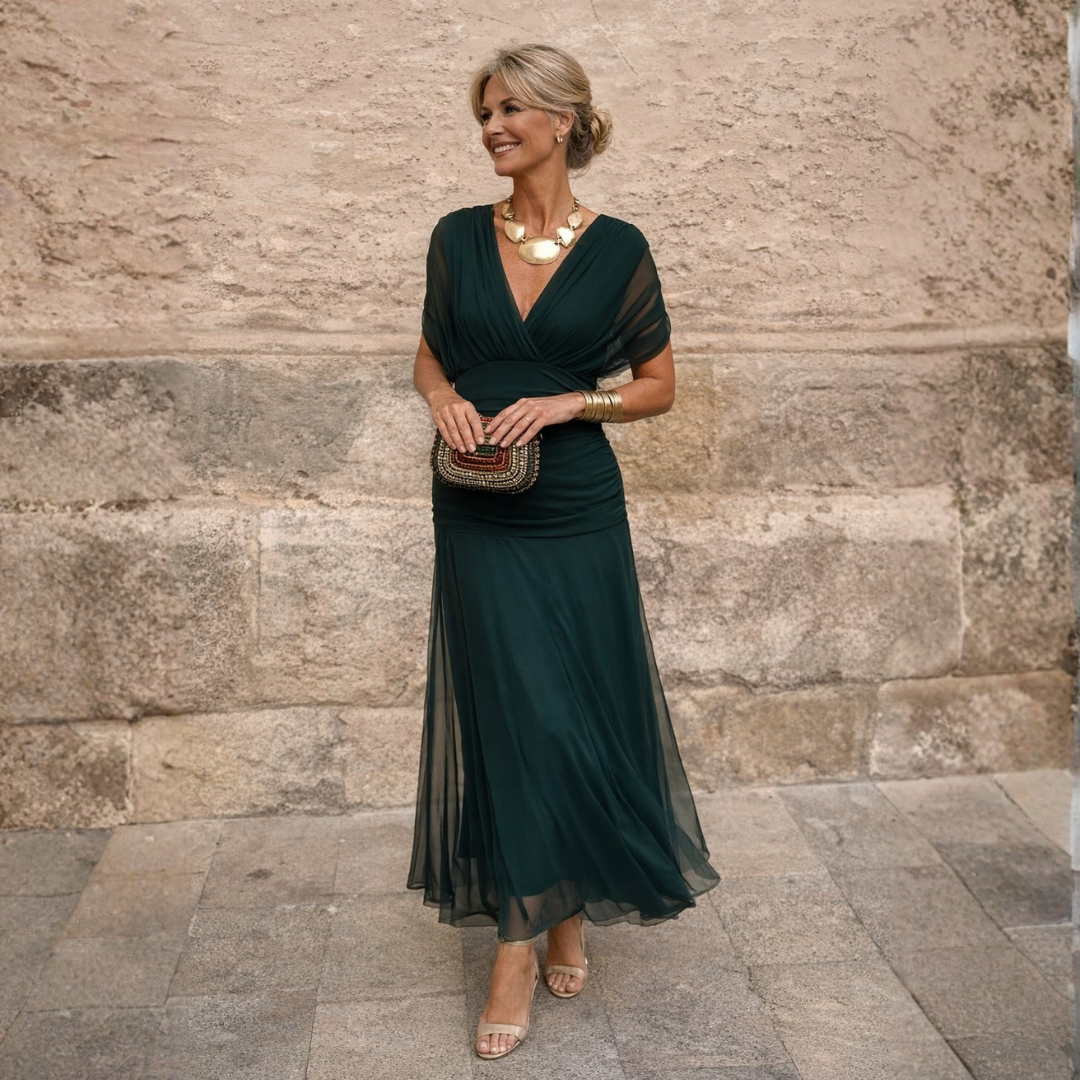 Elegant women's V-neck midi dress with flowing flutter sleeves, perfect for formal occasions.