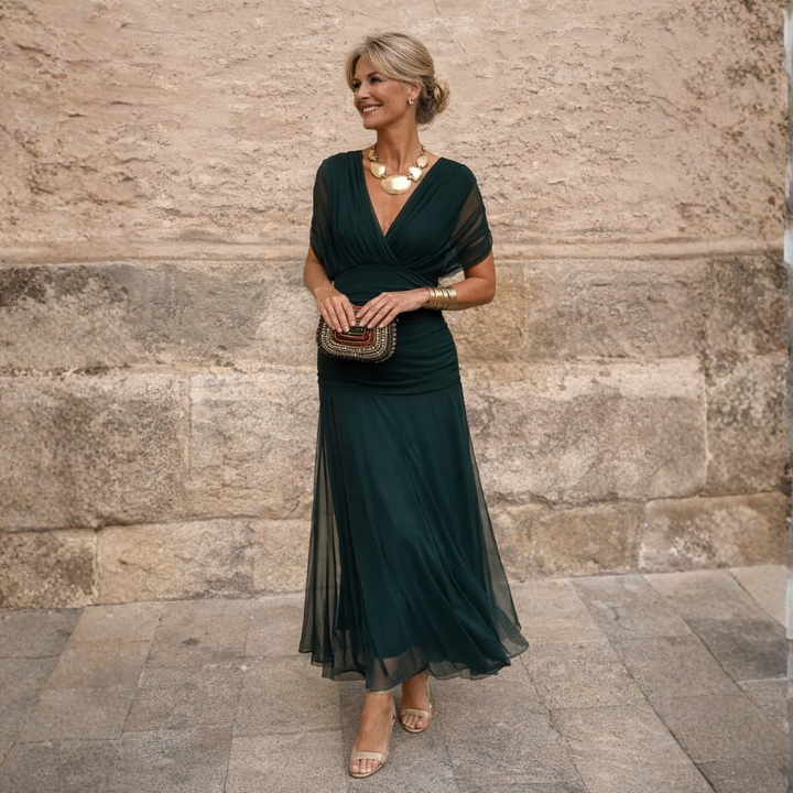 Elegant women's V-neck midi dress with flowing flutter sleeves, perfect for formal occasions.