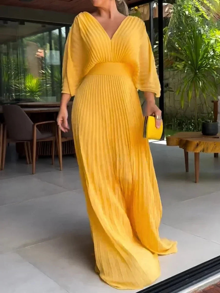 Women's V-neck kaftan maxi dress with elegant pleats & flowy design. Ideal for summer, vacation, & comfortable fashion.