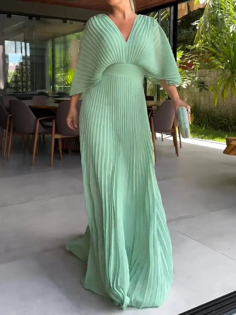 Comfortable women's V-neck pleated kaftan maxi dress. An elegant flowy design for summer, vacation, and special occasions.