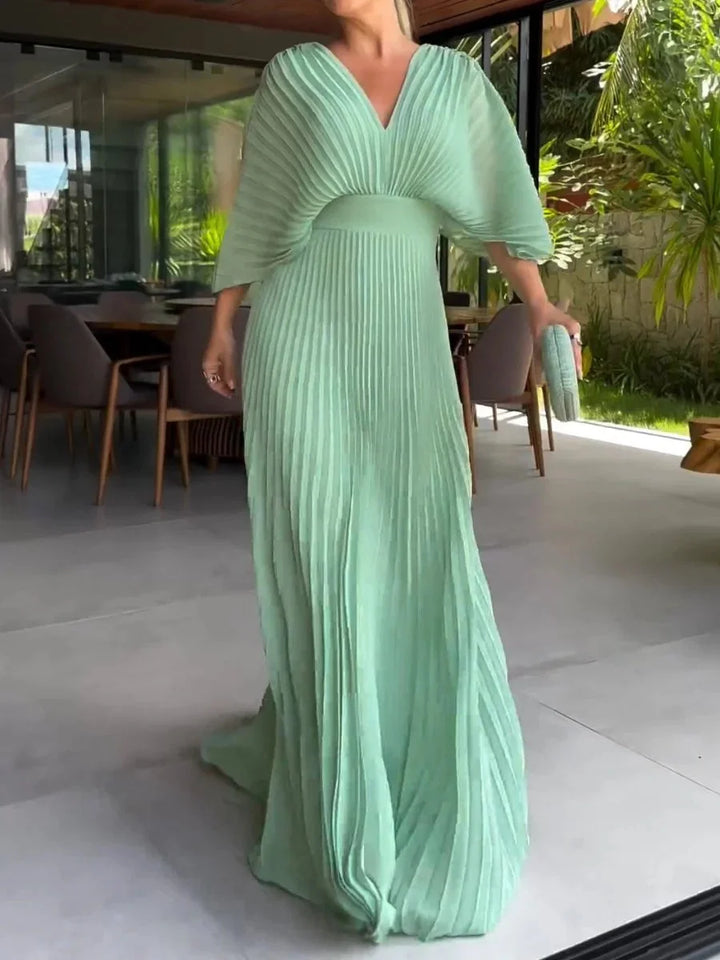 Comfortable women's V-neck pleated kaftan maxi dress. An elegant flowy design for summer, vacation, and special occasions.