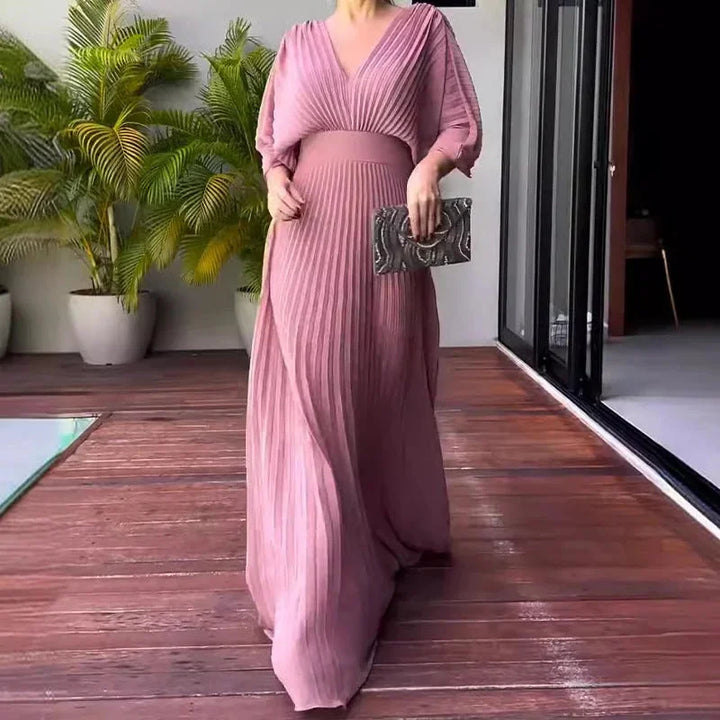 Beautiful women's V-neck pleated flowy kaftan maxi dress. Enjoy comfort and elegance for summer and vacation fashion.