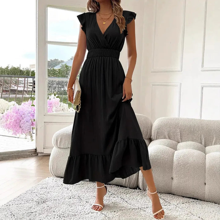 Stylish women's V-neck maxi dress with delicate ruffle trim, ideal for versatile spring fashion.