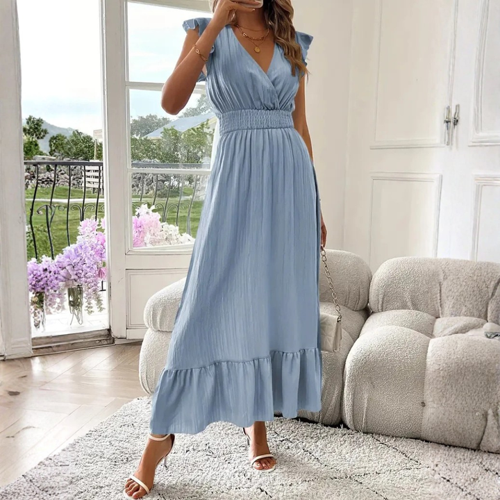 Flowy women's V-neck maxi dress with elegant ruffle trim, suitable for any party or casual outing.