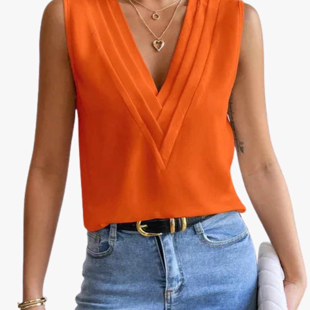 Close-up of elegant V-neck sleeveless women's blouse, highlighting the fabric & design. Versatile fashion.