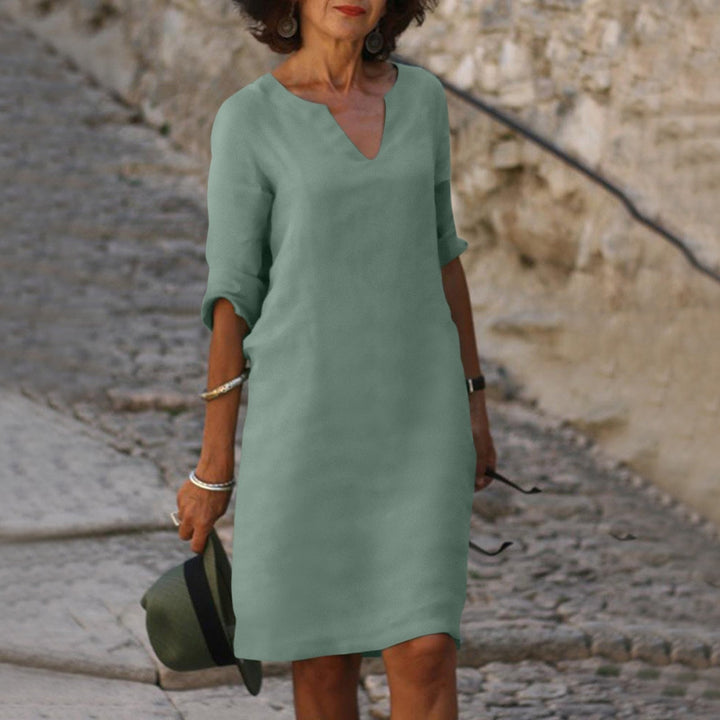 Comfortable women's V-neck summer midi dress, designed for casual elegance, vacation wear, and spring fashion.