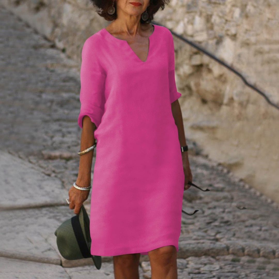 Vibrant women's V-neck summer midi dress, a chic and comfortable option for casual elegant vacation wear.