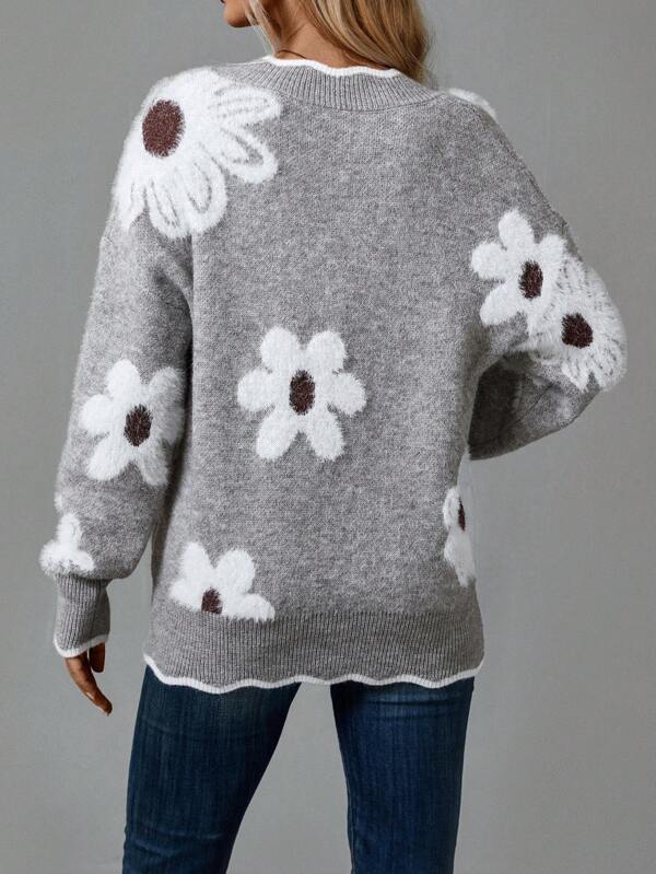 Cozy knit women's V-neck jumper with unique textured floral design for comfortable autumn and winter wear.
