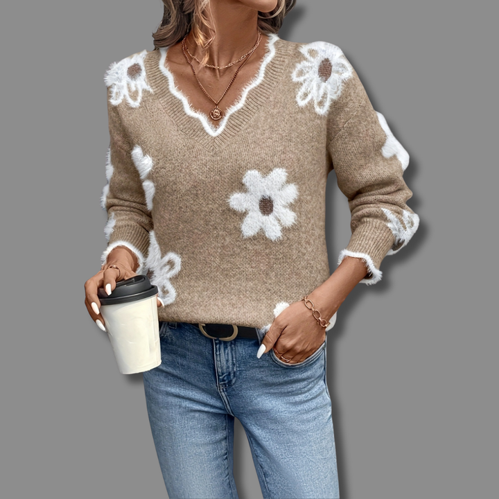 Relaxed fit long sleeve women's V-neck sweater, showcasing an elegant and unique floral design.