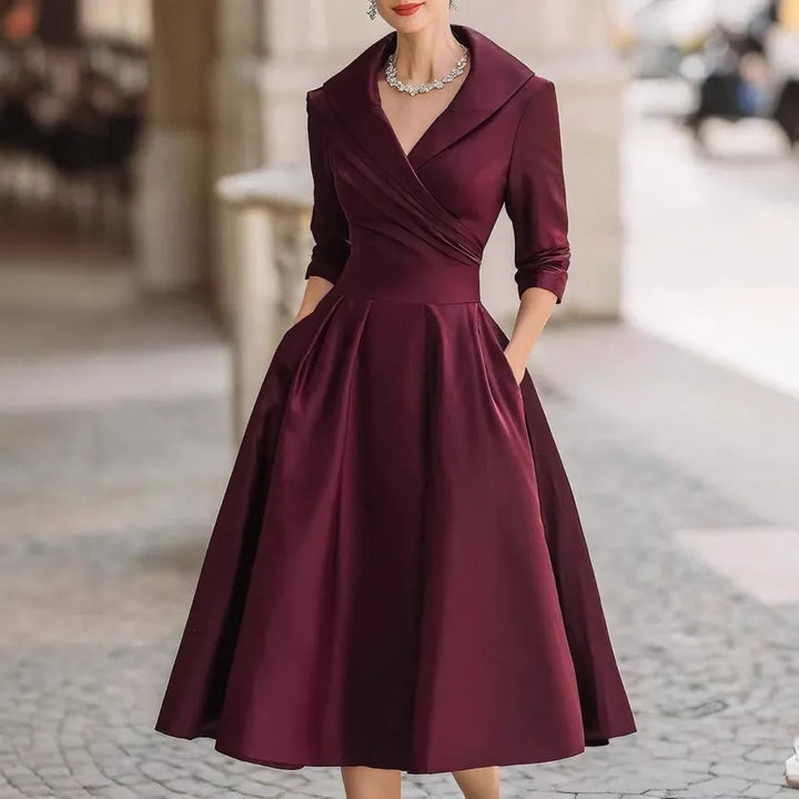 Sophisticated women's midi dress, V-neck, three-quarter sleeves. An elegant choice for any occasion or daily wear.