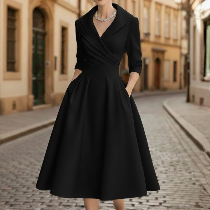 Women's elegant three-quarter sleeve V-neck midi dress, ideal for a chic look at any event or as a casual outfit.