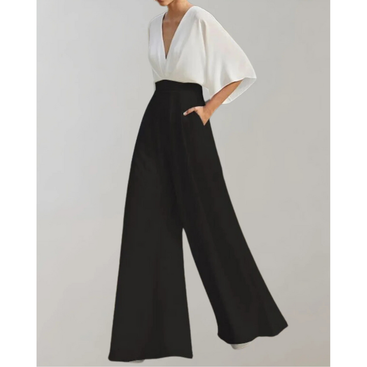 Women's sophisticated V-neck wide-leg jumpsuit, an elegant and modern flowy formal outfit.
