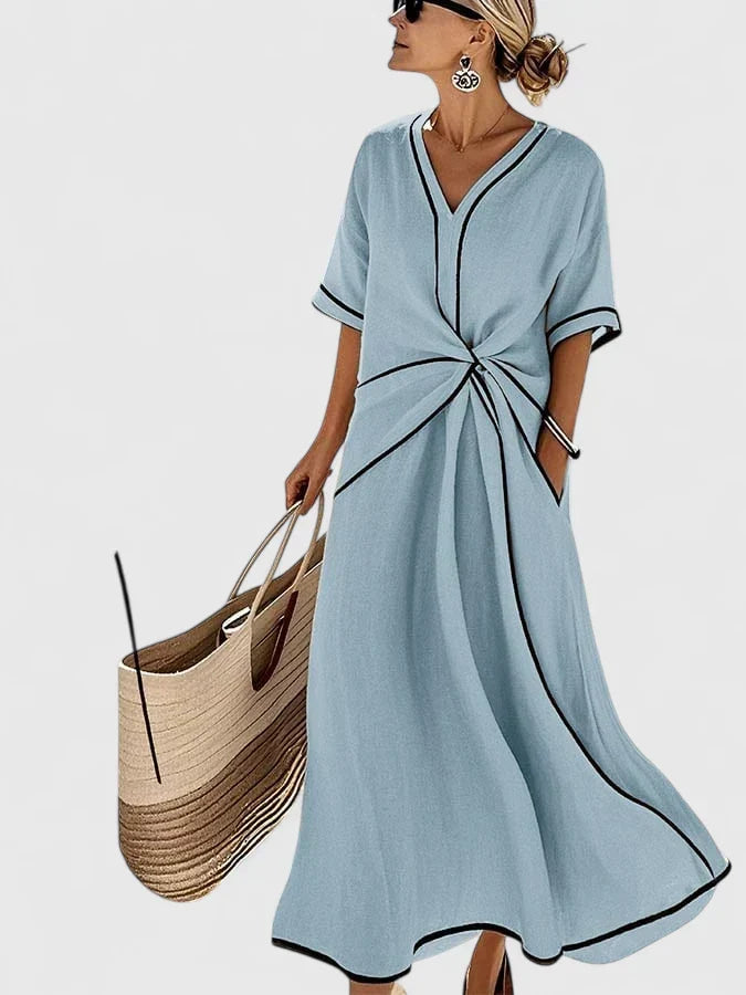 Versatile women's short sleeve striped summer dress. Flowing, relaxed fit ideal for casual or elegant warm weather wear.