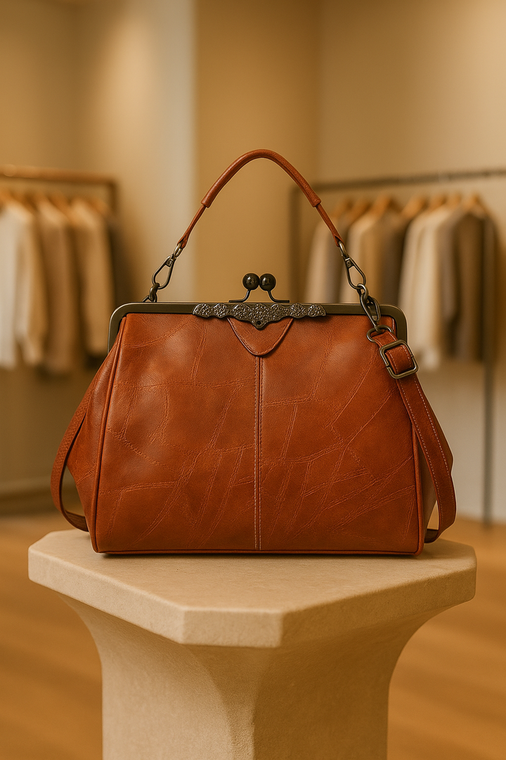 Elegant women's vintage brown leather shoulder bag with classic design & gold hardware.