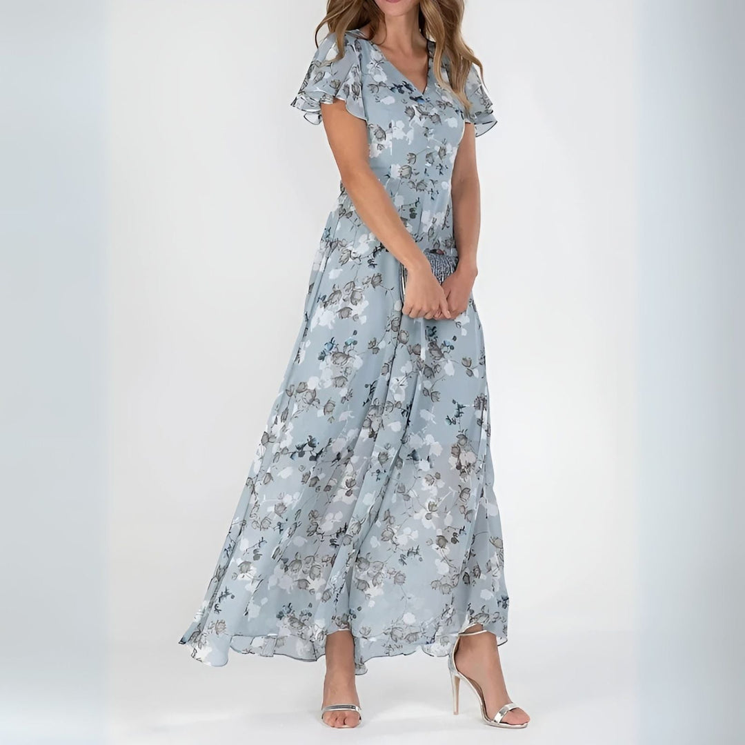 Flowing romantic watercolor floral maxi dress for women, ideal for a wedding guest or elegant summer event.