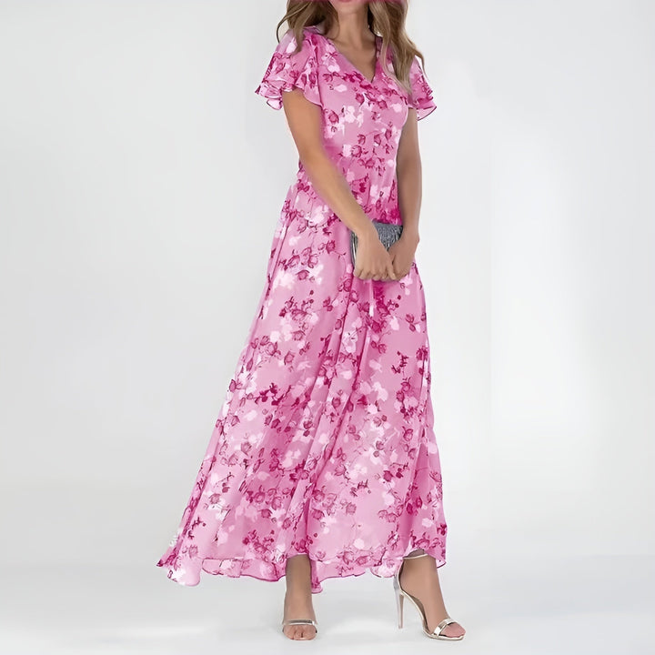 Women's elegant watercolor floral print maxi dress, a romantic choice for summer occasions or wedding guests.