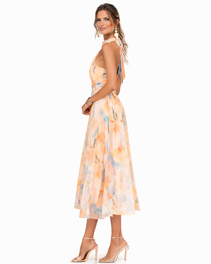 Summer-ready elegant maxi dress with a beautiful watercolor print & comfortable halter neck, ideal for parties.