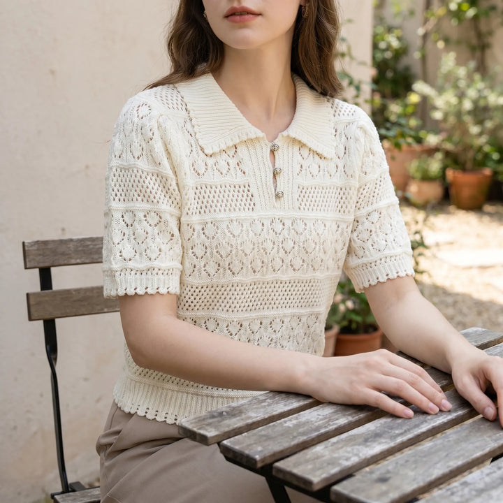 Elegant women's white crochet knit short-sleeve blouse with a stylish polo collar, perfect for summer fashion.