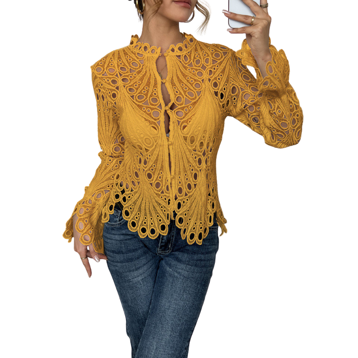 Romantic women's cutwork lace top featuring lantern sleeves & delicate tie front for a feminine summer style.