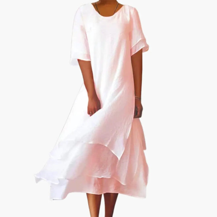 Chic women's pink sleeveless midi dress, fitted with a round neck, ideal for versatile everyday summer styling.
