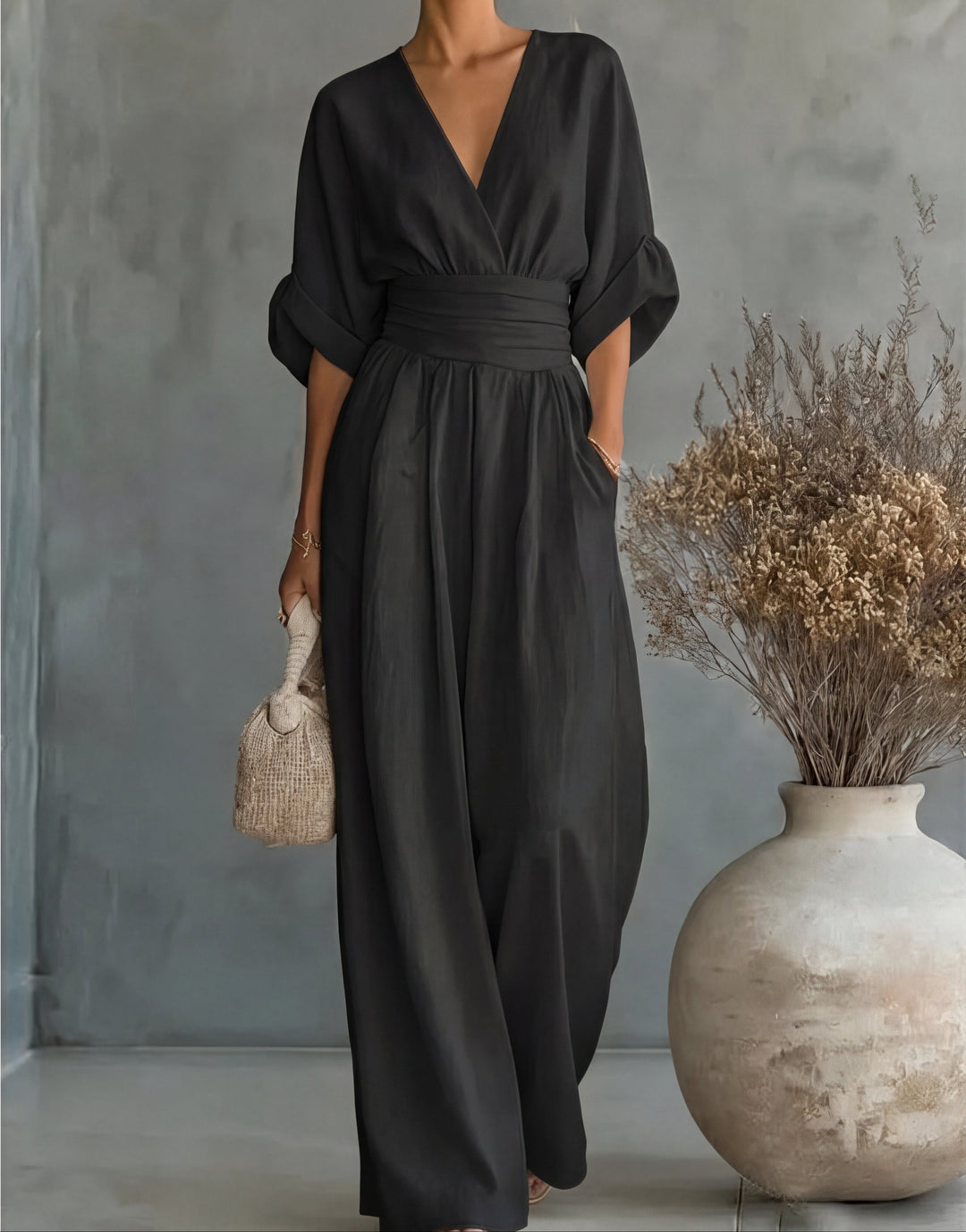 Women's chic wide-leg jumpsuit, flattering wrap front. Stylish & comfortable one-piece outfit.