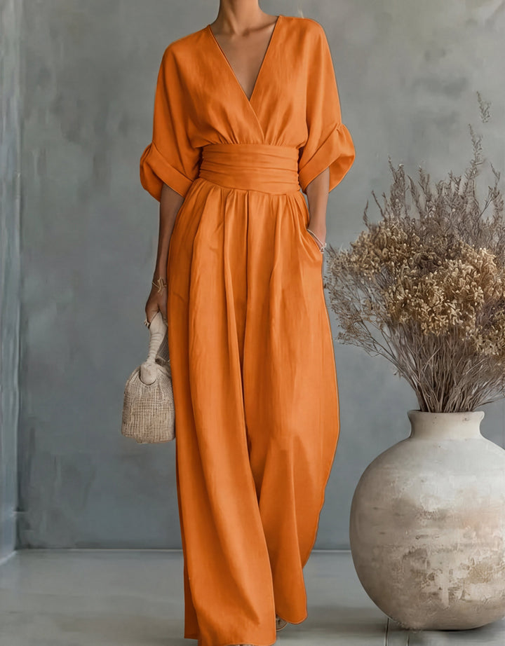 Elegant women's jumpsuit with wide legs and wrap front. Perfect for versatile spring fashion.