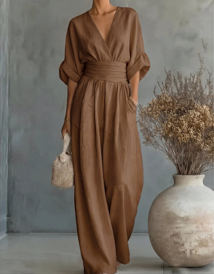 Stylish one-piece women's wide-leg jumpsuit, wrap front. Chic & comfortable for any occasion.