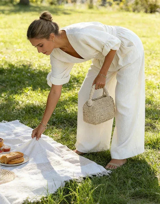 Flattering wrap front wide-leg jumpsuit for women. Comfortable & elegant spring/summer fashion.