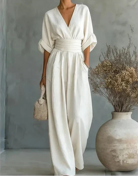 Women's elegant wide-leg jumpsuit with stylish wrap design. Ideal for versatile fashion & comfort.