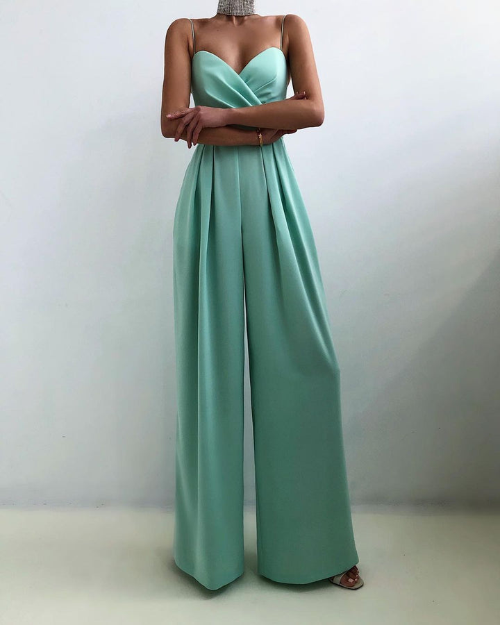 Chic women's spaghetti strap wide-leg jumpsuit, a stylish and flattering sleeveless outfit for modern party wear.