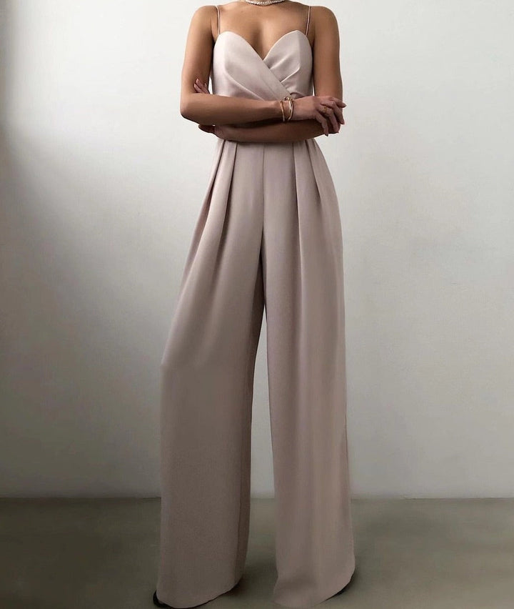 Sophisticated women's wide-leg jumpsuit featuring delicate spaghetti straps, ideal for elegant evening events.
