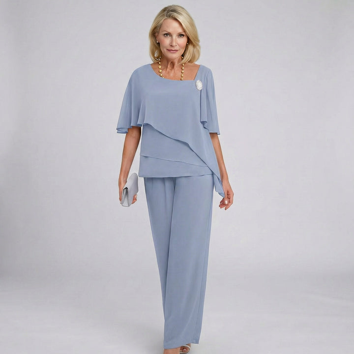 Elegant women's wide-leg pant set with flutter sleeves, perfect for formal events, weddings, or evening wear.