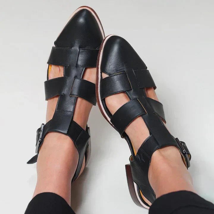 Stylish black woven flat strap sandals for women. Comfortable summer shoes, great for elegant casual wear or travel.