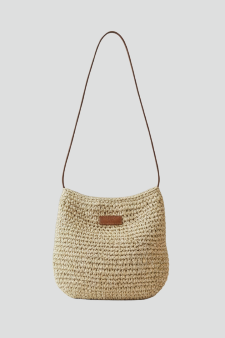 Elegant women's woven shoulder bag in beige, a compact and stylish everyday crossbody purse for fashion.