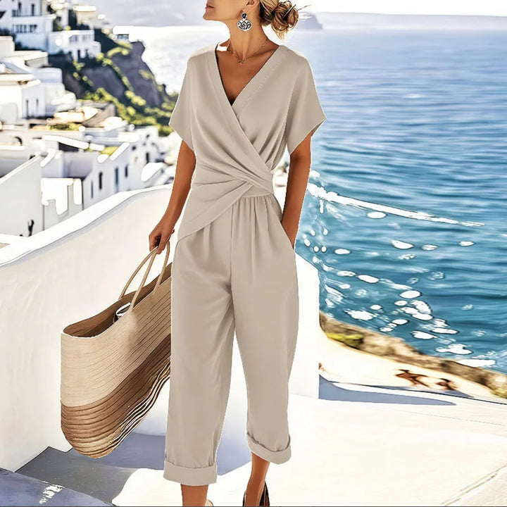 Elegant women's wrap-style cropped jumpsuit. Perfect for summer vacation & chic casual wear. Available in apricot, blue, khaki.