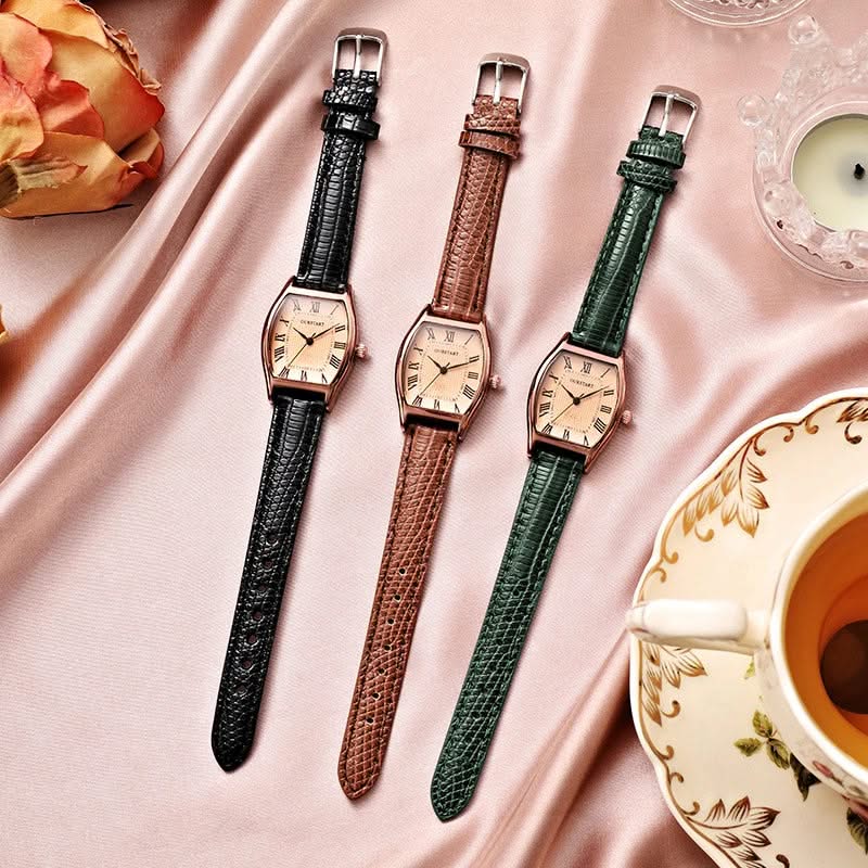 Black women's elegant wristwatch with Roman numerals, analog display, and adjustable band for a sophisticated look.