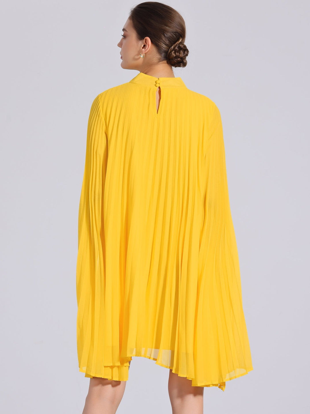 Flowy yellow pleated swing dress for women, with mock neck & cape sleeves. Ideal for summer parties.