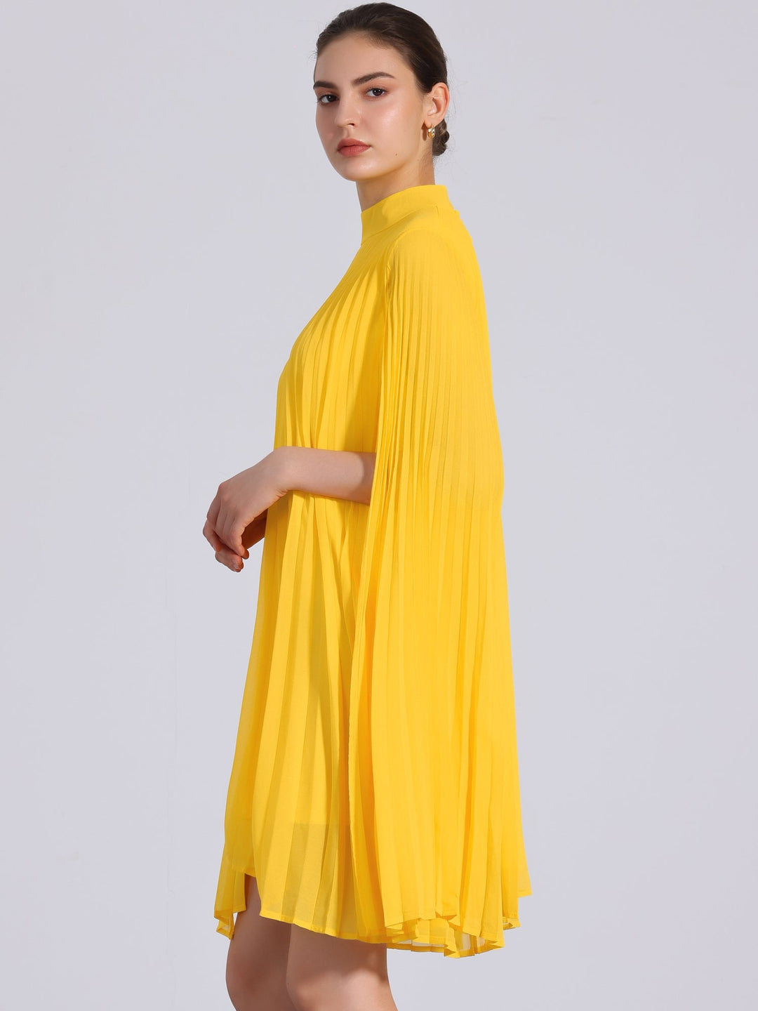 Women's vibrant yellow pleated swing dress, featuring a chic mock neck & elegant cape sleeves.