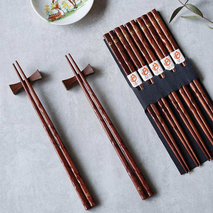 Elegant wooden chopsticks with golden cherry blossom design, perfect for Asian cuisine & dining. Set of 5 pairs.