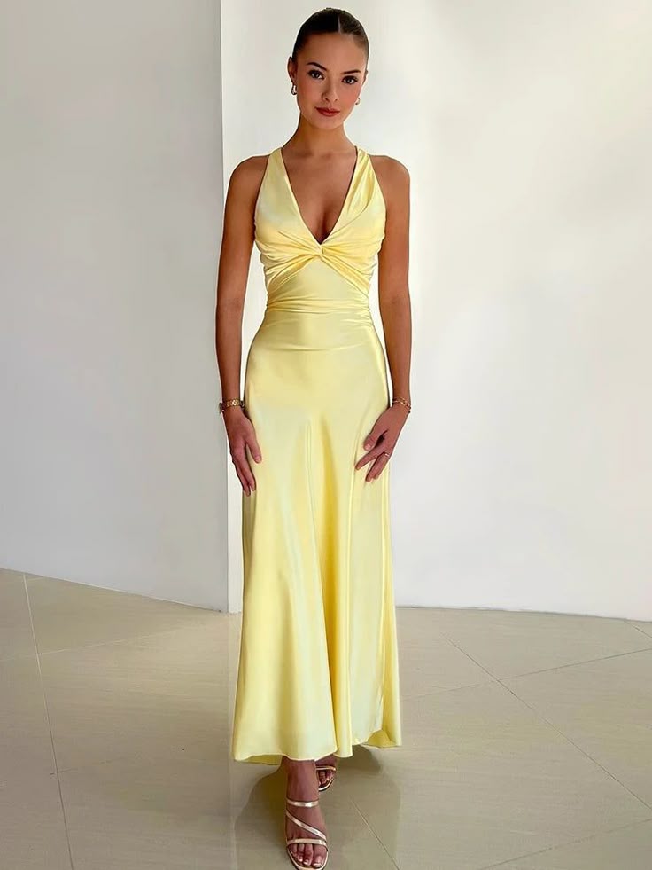 Elegant yellow V-neck maxi dress for women, perfect as a flowing wedding guest or formal evening gown with ruched details.