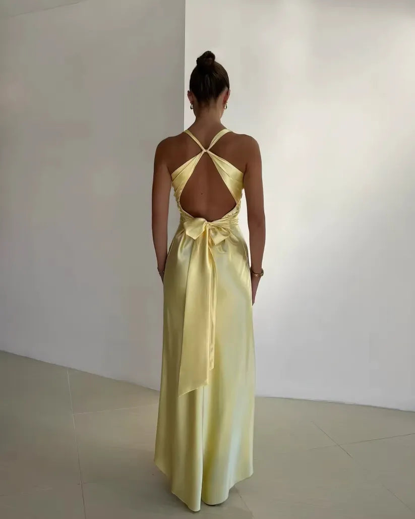 Sophisticated women's V-neck maxi wedding guest dress. A formal, elegant evening gown ideal for special occasions.