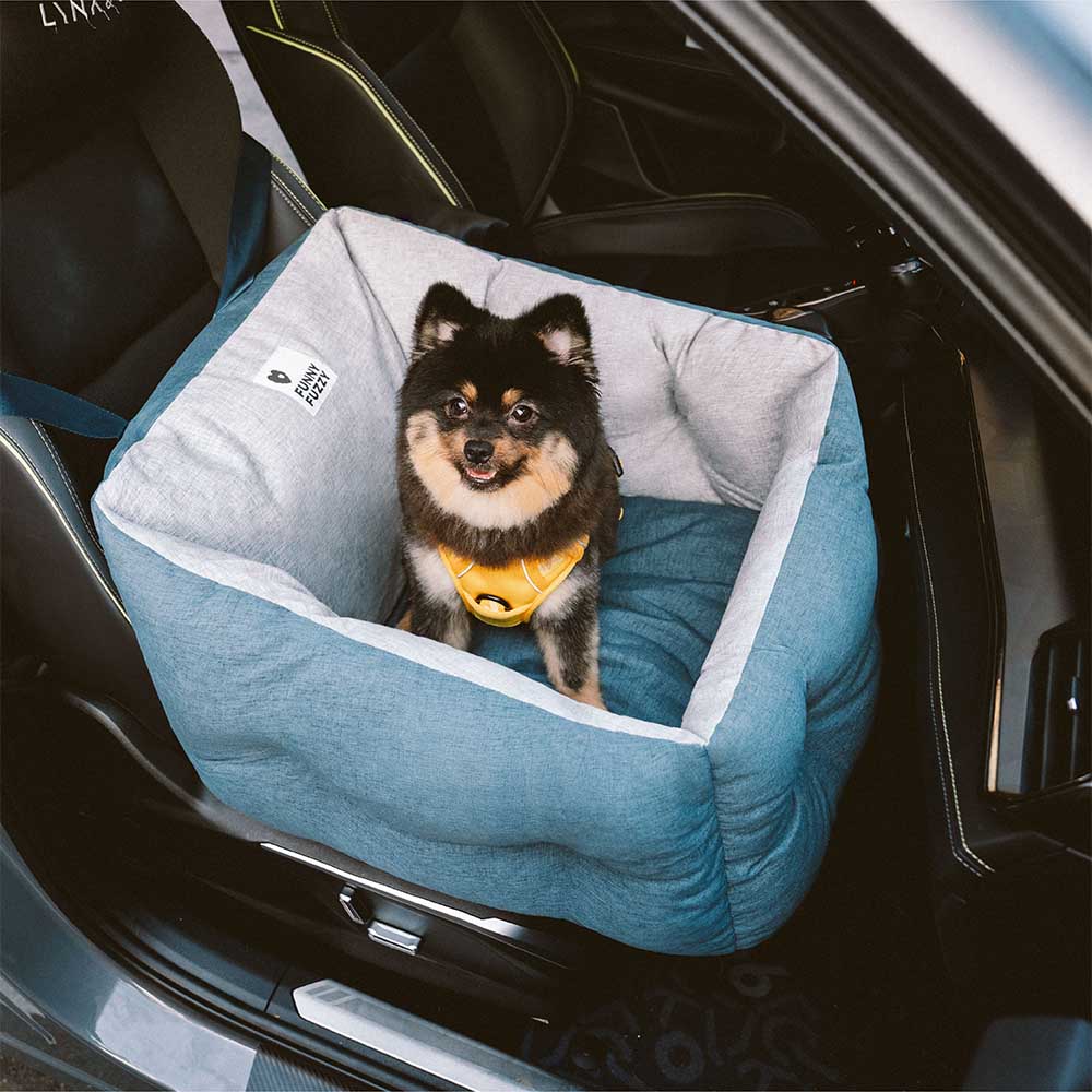 Dog car travel accessory, a thickened booster seat in grey, ensuring pet safety and comfort on road trips.