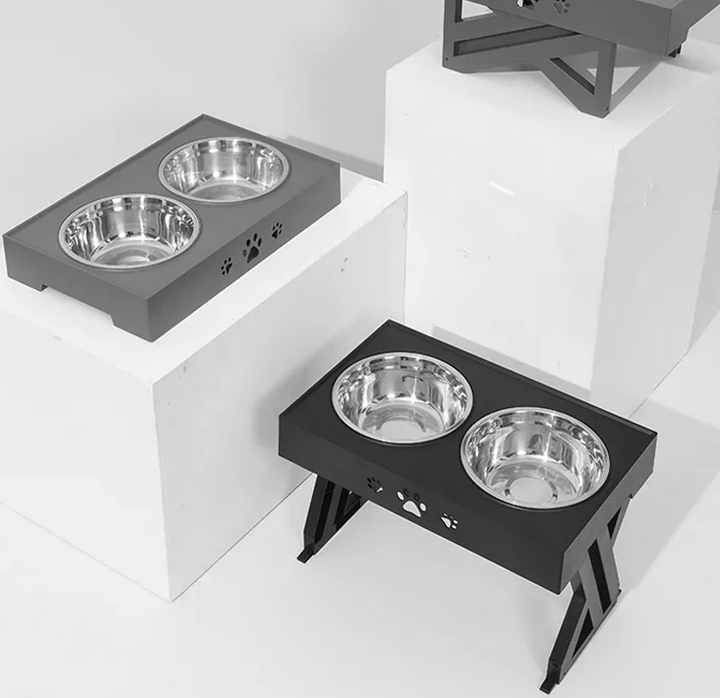 Unisex black elevated dog feeder with adjustable height, featuring easy-to-clean stainless steel pet food bowls.