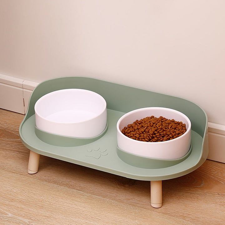 Modern double diner elevated dog and cat bowls, white ceramic on a wooden stand, comfortable pet feeding