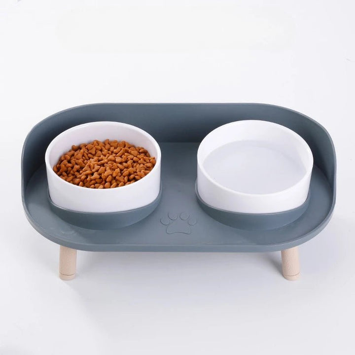 Modern elevated bamboo pet feeder with two removable stainless steel non-slip bowls for ergonomic pet health